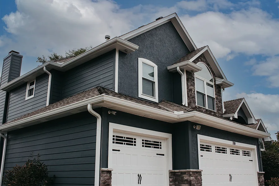 Completed home exterior with new siding and white trim